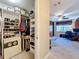 Organized walk-in closet with shelving and storage solutions, leading into an office at 4208 Clubside Dr # 4208, Longwood, FL 32779