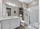 Bathroom with white vanity, toilet and shower at 421 Nowell Loop, Deland, FL 32724