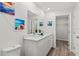 Clean bathroom with double vanity, white cabinets, and a walk-in closet at 4386 Sw 169Th Lane Rd, Ocala, FL 34473
