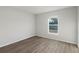 Empty bedroom with wood-look flooring and a window at 4386 Sw 169Th Lane Rd, Ocala, FL 34473