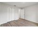 Empty bedroom with wood-look floors and double door closet at 4386 Sw 169Th Lane Rd, Ocala, FL 34473