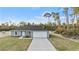 Single story home with attached garage and a landscaped yard at 4386 Sw 169Th Lane Rd, Ocala, FL 34473