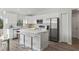 Modern white kitchen with stainless steel appliances and large island at 4386 Sw 169Th Lane Rd, Ocala, FL 34473