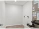 Bright laundry room with vinyl flooring and space for a washer and dryer at 4386 Sw 169Th Lane Rd, Ocala, FL 34473