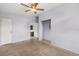 Simple bedroom with ceiling fan and access to bathroom at 4443 Seils Way, Orlando, FL 32812