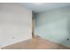 Empty bedroom with light teal walls and open door at 4443 Seils Way, Orlando, FL 32812