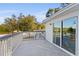 Private deck with view of backyard and trees at 4530 N Hiawassee Rd, Orlando, FL 32818