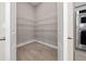 Spacious pantry with wood-style floors and wire shelving for ample storage at 4544 Gliding Wave St, Winter Garden, FL 34787