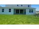 Back of the house featuring a porch and large yard at 5067 Northern Dove Ave, Mount Dora, FL 32757