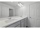 Elegant bathroom with a double sink vanity, ample lighting, and modern fixtures at 5067 Northern Dove Ave, Mount Dora, FL 32757