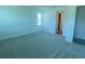 Carpeted bedroom featuring large windows for ample natural light at 5067 Northern Dove Ave, Mount Dora, FL 32757