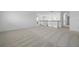 Bright and airy loft space featuring neutral carpet and white railing at 5067 Northern Dove Ave, Mount Dora, FL 32757