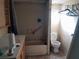 Bathroom with a tub, toilet, and wood vanity at 5149 Bryant Ave, Sanford, FL 32773