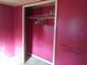 The closet features pink walls and a shelf with clothes hangers at 5149 Bryant Ave, Sanford, FL 32773