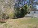 Side yard with trees and plants at 5149 Bryant Ave, Sanford, FL 32773