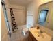 Clean bathroom with shower/tub combo and vanity at 553 Vista Way Ln Ln, Eagle Lake, FL 33839