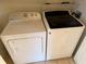 Laundry room with Whirlpool washer and dryer, ready for use at 553 Vista Way Ln Ln, Eagle Lake, FL 33839