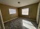 Well lit bedroom with tile floors and neutral color palette at 5917 Wolf Rd, Orlando, FL 32808