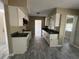 Kitchen with white cabinets, granite countertops, and tile floors at 5917 Wolf Rd, Orlando, FL 32808