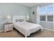 Light and airy bedroom with a full-size bed and nightstands at 603 Lazio Cir, Debary, FL 32713