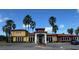 Community clubhouse with inviting entrance and landscaping at 603 Lazio Cir, Debary, FL 32713
