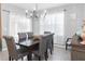 Bright dining room with chandelier and seating for six at 603 Lazio Cir, Debary, FL 32713
