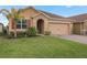 Attractive single-story home with a two-car garage and well-manicured lawn at 603 Lazio Cir, Debary, FL 32713