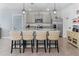 Island kitchen with granite countertops, stainless steel appliances, and seating at 603 Lazio Cir, Debary, FL 32713