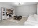 Modern living room with large TV and built-in shelving at 603 Lazio Cir, Debary, FL 32713