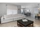 Spacious living room with sectional sofa and ottoman at 603 Lazio Cir, Debary, FL 32713