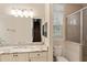 Bathroom with single vanity, granite countertop, and view of stairs at 6220 Cartmel Ln, Windermere, FL 34786