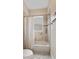 Simple bathroom with shower/tub combo and tile surround at 6220 Cartmel Ln, Windermere, FL 34786