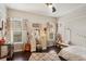 Cozy bedroom with vanity, guitar, and ample natural light at 6220 Cartmel Ln, Windermere, FL 34786