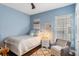 Bright bedroom with a comfortable bed and sitting area at 6220 Cartmel Ln, Windermere, FL 34786