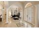 Grand entry with high ceilings, marble floors, and a piano at 6220 Cartmel Ln, Windermere, FL 34786