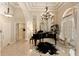 Grand entry with high ceilings, marble floors, and a piano at 6220 Cartmel Ln, Windermere, FL 34786
