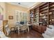 Study with built-in shelves and plenty of natural light at 6220 Cartmel Ln, Windermere, FL 34786