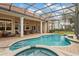 Large pool and spa with screened patio and seating area at 6220 Cartmel Ln, Windermere, FL 34786