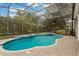 Inviting screened pool and spa with tiled decking at 6220 Cartmel Ln, Windermere, FL 34786