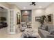 Sitting area with stone accent wall and comfortable seating at 6220 Cartmel Ln, Windermere, FL 34786