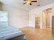 Primary bedroom with wood floors and access to a large closet at 6808 Cherry Grove Cir, Orlando, FL 32809