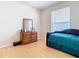 Bedroom with daybed, built-in desk, and large window at 6808 Cherry Grove Cir, Orlando, FL 32809