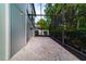 Screened patio with brick pavers and string lights at 749 Silver Birch Pl, Longwood, FL 32750