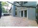 Spacious backyard patio with brick pavers, screened enclosure, and hot tub at 749 Silver Birch Pl, Longwood, FL 32750