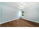 Bedroom with hardwood floors, ceiling fan and window at 749 Silver Birch Pl, Longwood, FL 32750
