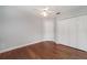 Light blue bedroom with hardwood floors and ceiling fan at 749 Silver Birch Pl, Longwood, FL 32750