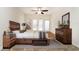 Bright bedroom with wood furniture and access to backyard at 749 Silver Birch Pl, Longwood, FL 32750