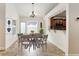 Dining area with a round table and chairs, adjacent to kitchen at 749 Silver Birch Pl, Longwood, FL 32750