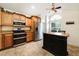 Kitchen with stainless steel appliances and wood cabinets at 749 Silver Birch Pl, Longwood, FL 32750