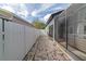 Long side yard with white fence and brick path at 749 Silver Birch Pl, Longwood, FL 32750